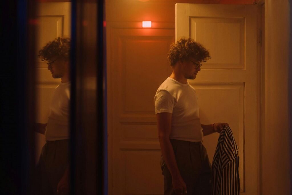 a man standing at a door wondering if staying in marriage after infidelity works