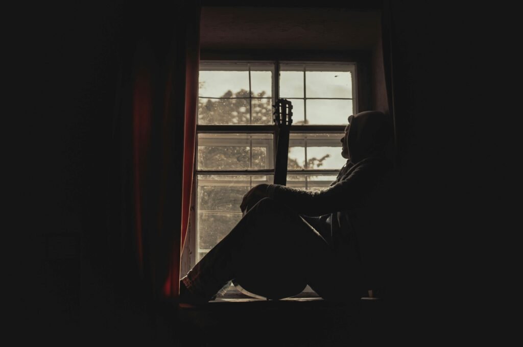 man alone thinking whether staying married after cheating is worth it