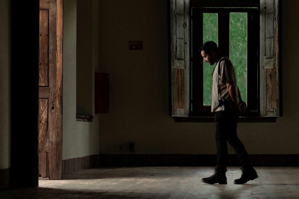 man about to walk through the door after thinking about betrayal